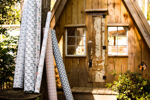picture of alpaca, mountain, pine tree, and western styled fabrics with rustic cabin outdoors