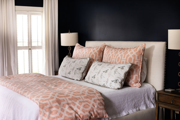 Photo of classic modern bedroom with spice peach colored fabric