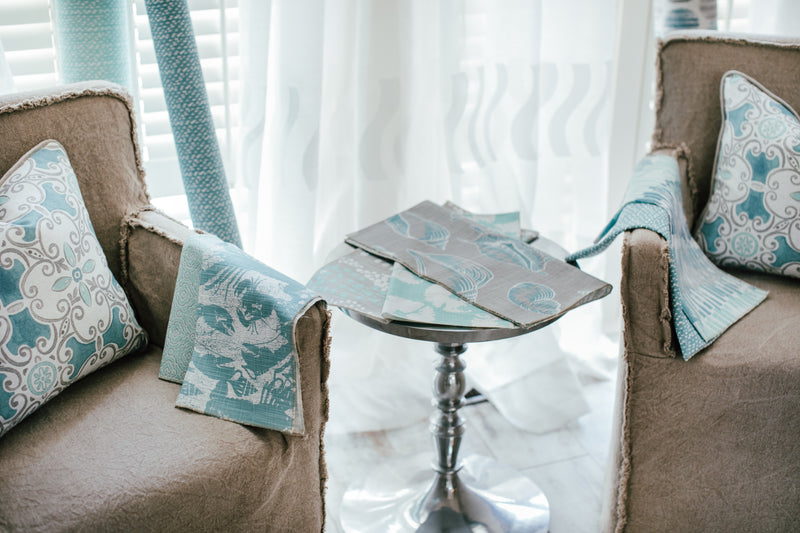 Photo of nautical themed lobster fabric laying on chair arm