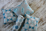Photo of nautical themed fabric pillows sea shells modern fabric