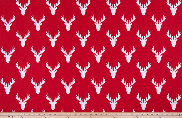 picture of repeating deer head antler pattern printed on cotton fabric.