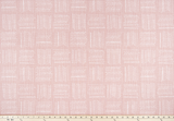 Photo of pink fabric with a square geometric pattern