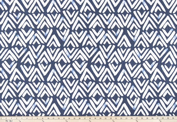 photo of white diamond pattern on blue fabric