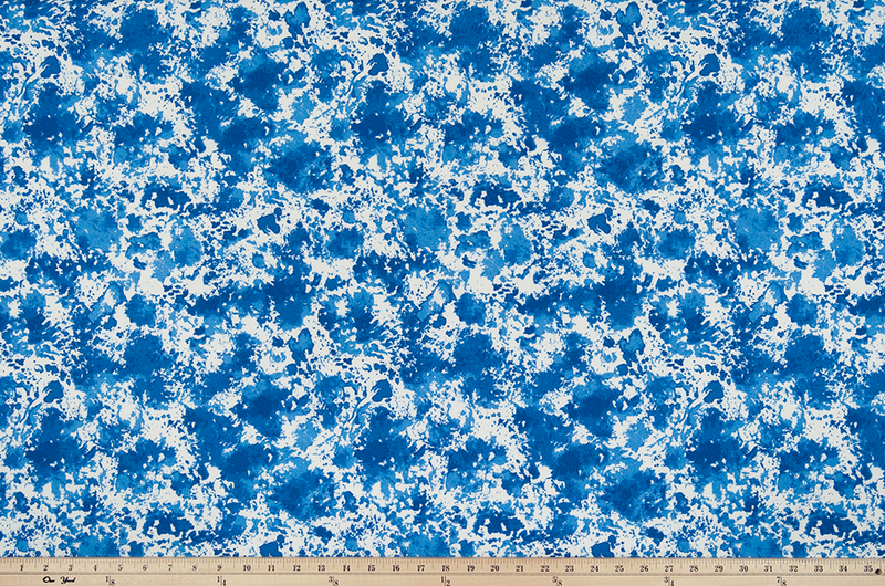 photo of abstract splatter cloud pattern printed on outdoor beach pool fabric