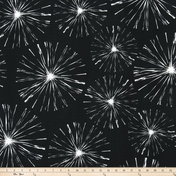 picture of white sparks fireworks printed on black outdoor fabric