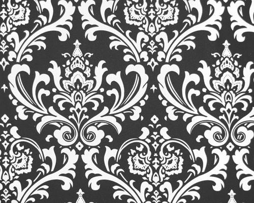 Photo of repeating white Damask pattern printed on black fabric