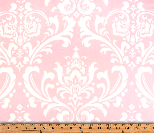 Photo of repeating white Damask pattern printed on pink fabric
