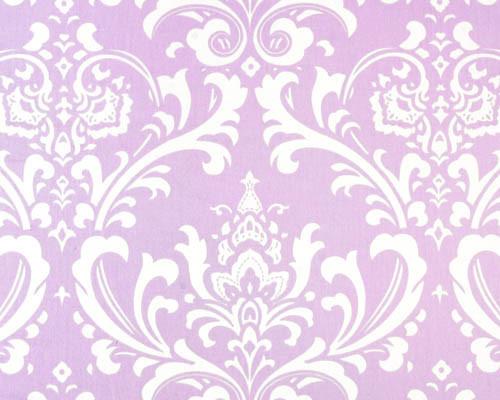 Photo of repeating white Damask pattern printed on purple fabric