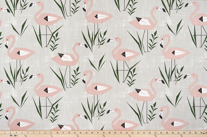 cotton fabric with pink flamingos and green grass