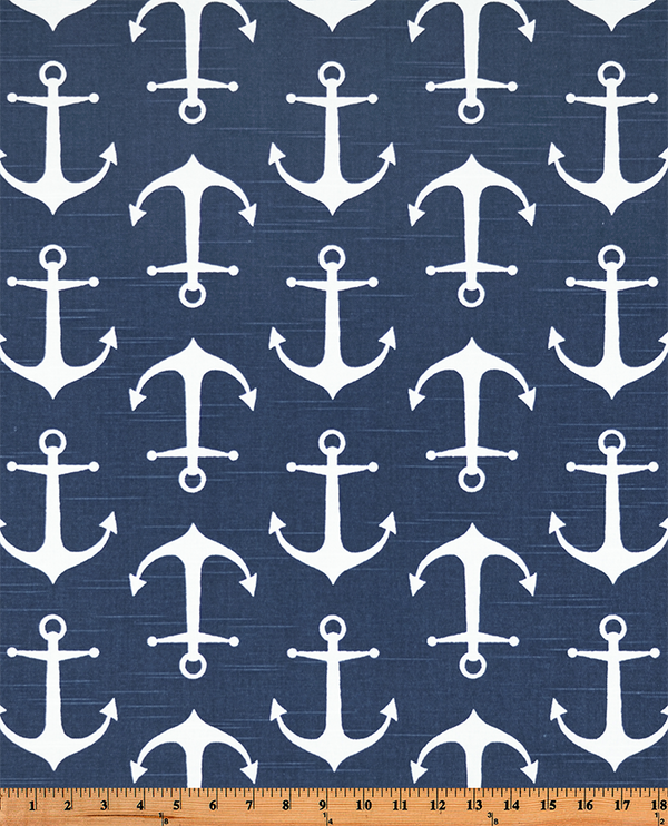 Photo of white repeating ship anchor pattern on blue fabric