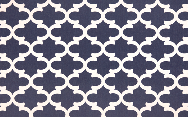 Photo of blue Quatrefoil trellis pattern printed on white fabric