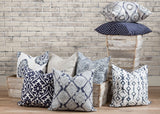 picture of pillows made with white and navy blue luxury fabric in wooden barn farm troth 