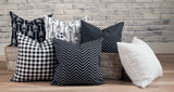 picture of pillows made with white and black luxury fabric in wooden barn farm troth