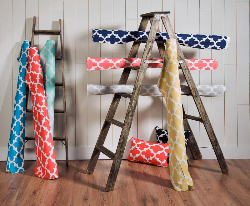 picture of fynn Moroccan trellis lattice pattern fabrics sitting on ladder in modern new york apartment